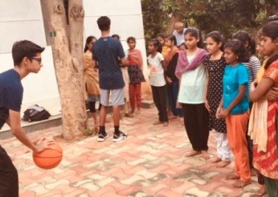 Youth Ambassador teaching basketball | SDIE